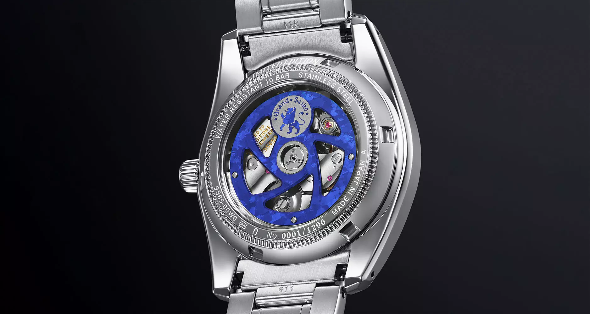 The vivid blue anodised oscillating rotor of the Calibre 9S65 is visible through the sapphire caseback.