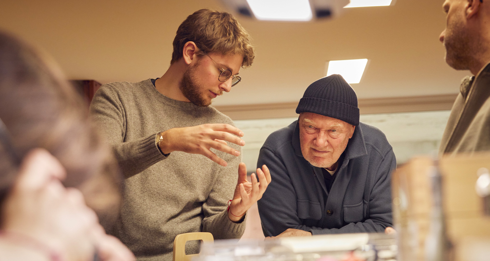 Pierre and Jean-Claude Biver discussing aspects of the watch in their studio.